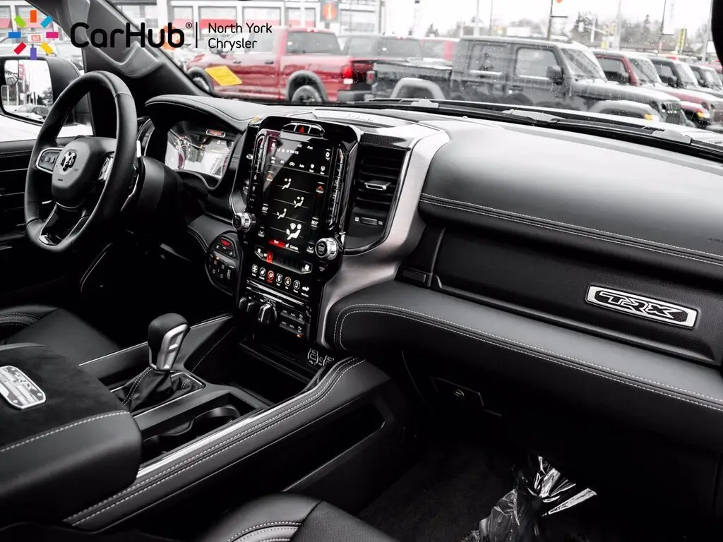 Ram 1500 TRX black leather interior dashboard and touchscreen at CarHub North York Chrysler