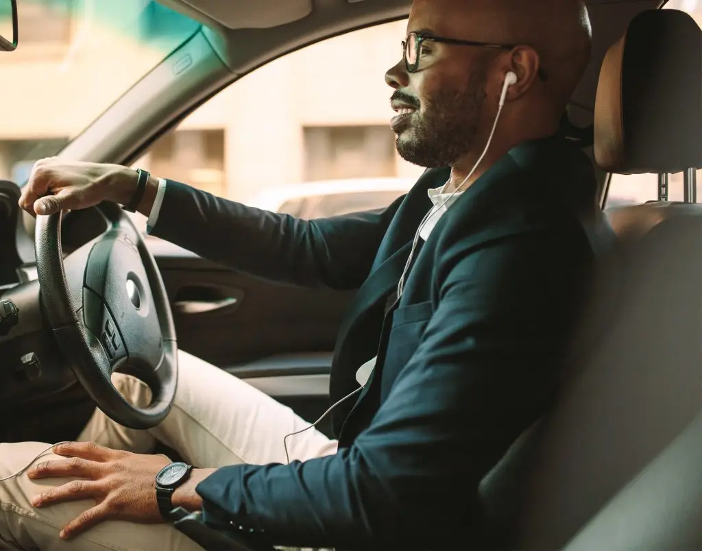 Man at the wheel of a car