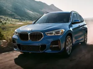 BMW X1 driving on a road
