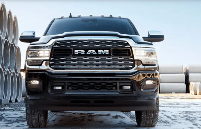 Black Ram heavy-duty pickup truck front grille and headlights close-up