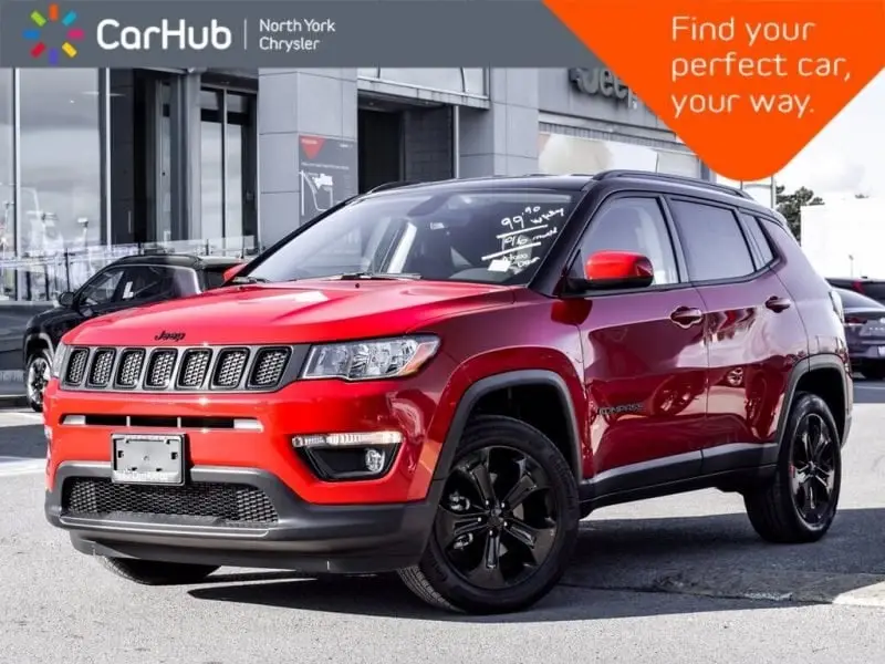 Red Jeep Compass SUV with black roof for sale at CarHub North York Chrysler