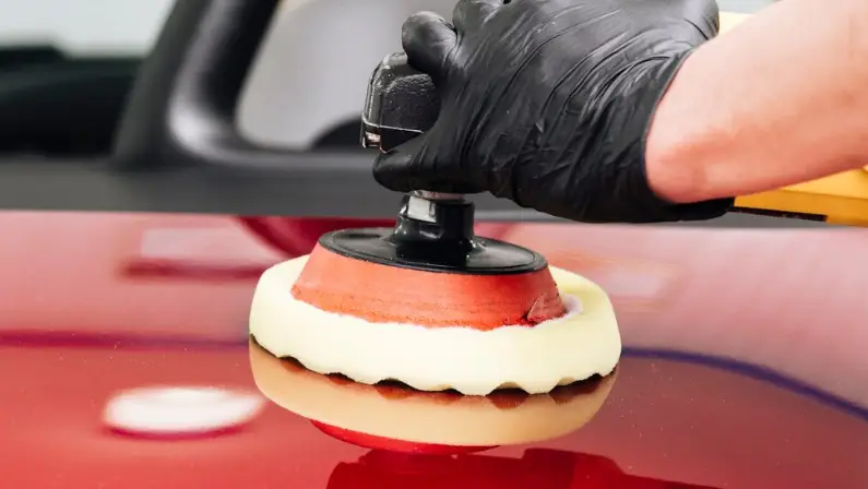 a-man-holding-a-cleaning-putty