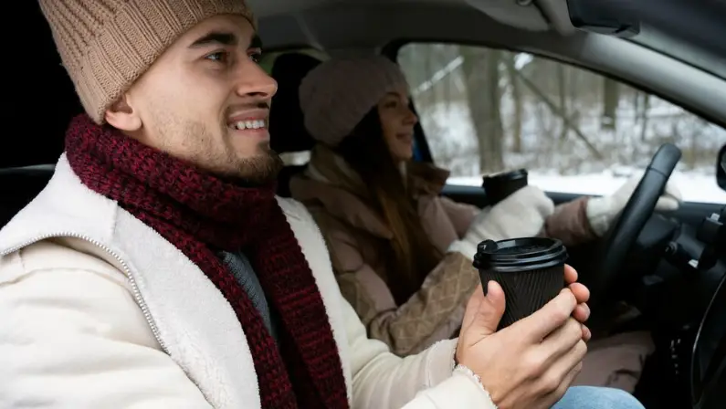 a-man-holding-a-travel-mug