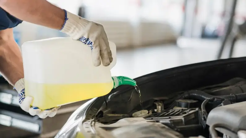 a-man-changing-a-new-oil-in-his-car