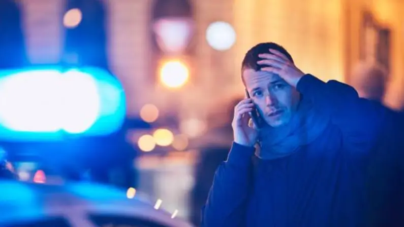 a-man-calling-the-police-for-help