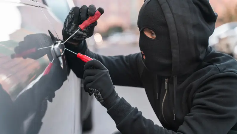 a-man-trying-to-steal-a-car