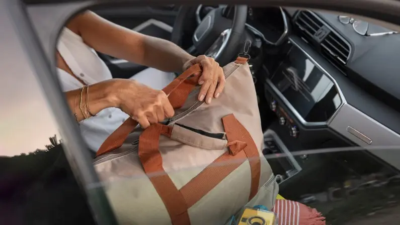 a-woman-hiding-her-things-in-the-car