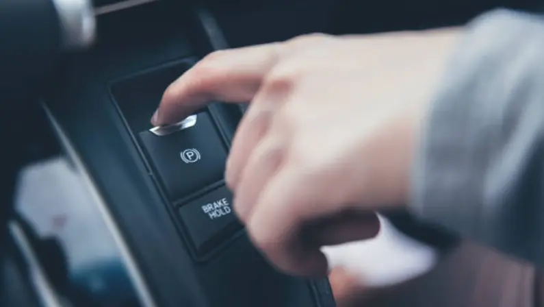 a-man-putting-on-his-parking-break