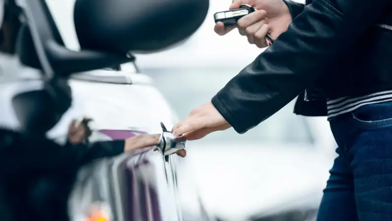 a-woman-opening-her-car-safely