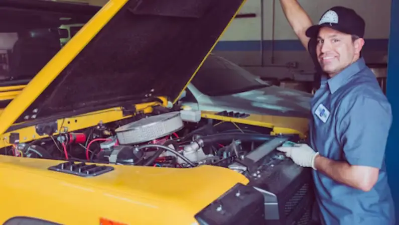 a-man-doing-a-car-maintenance-service-with-a-yellow-car