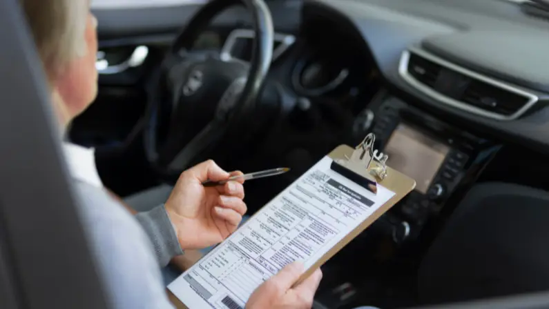 a-man-checking-the-vehicle-history-report