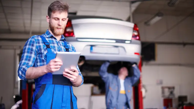 a-man-inspecting-a-car-for any-damages