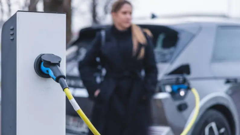 a-woman-charging-her-eco-friendly-car