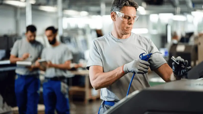 a-man-working-on-a-car-factory