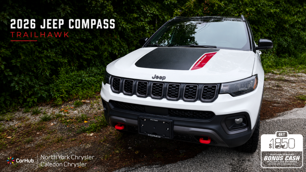 2026 Jeep Compass Trailhawk white SUV front view with red anniversary bonus cash offer - North York Chrysler & Caledon Chrysler
